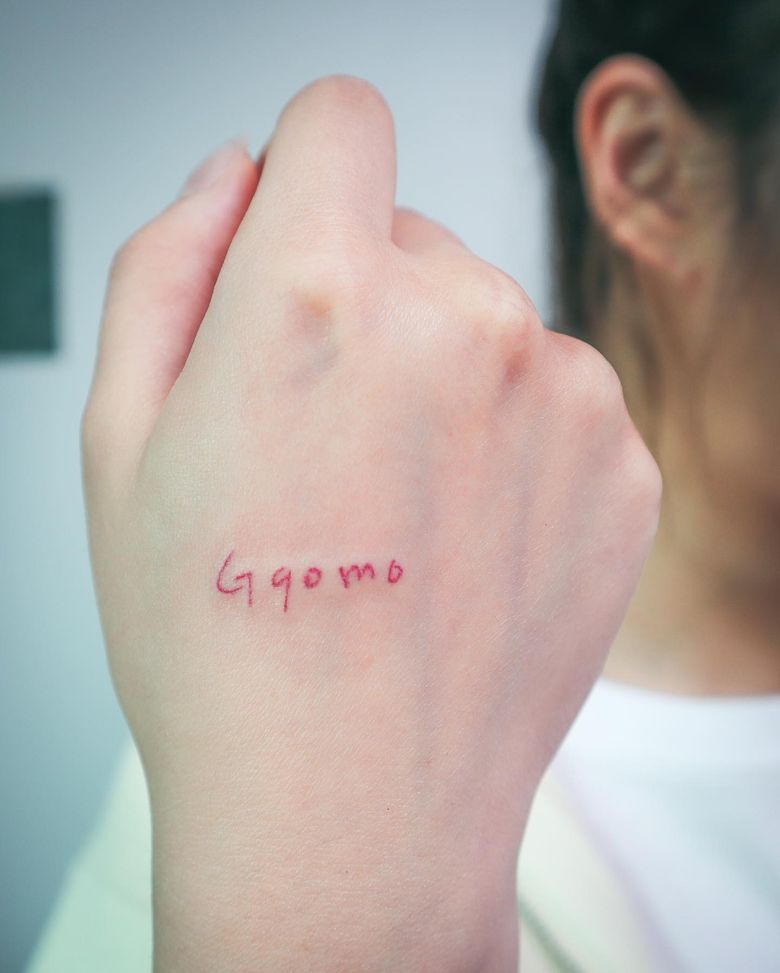 Tattoo Meaning: MAMAMOO WheeIn's Ggomo Hand Tattoo And Perfume Bottle Arm Tattoo